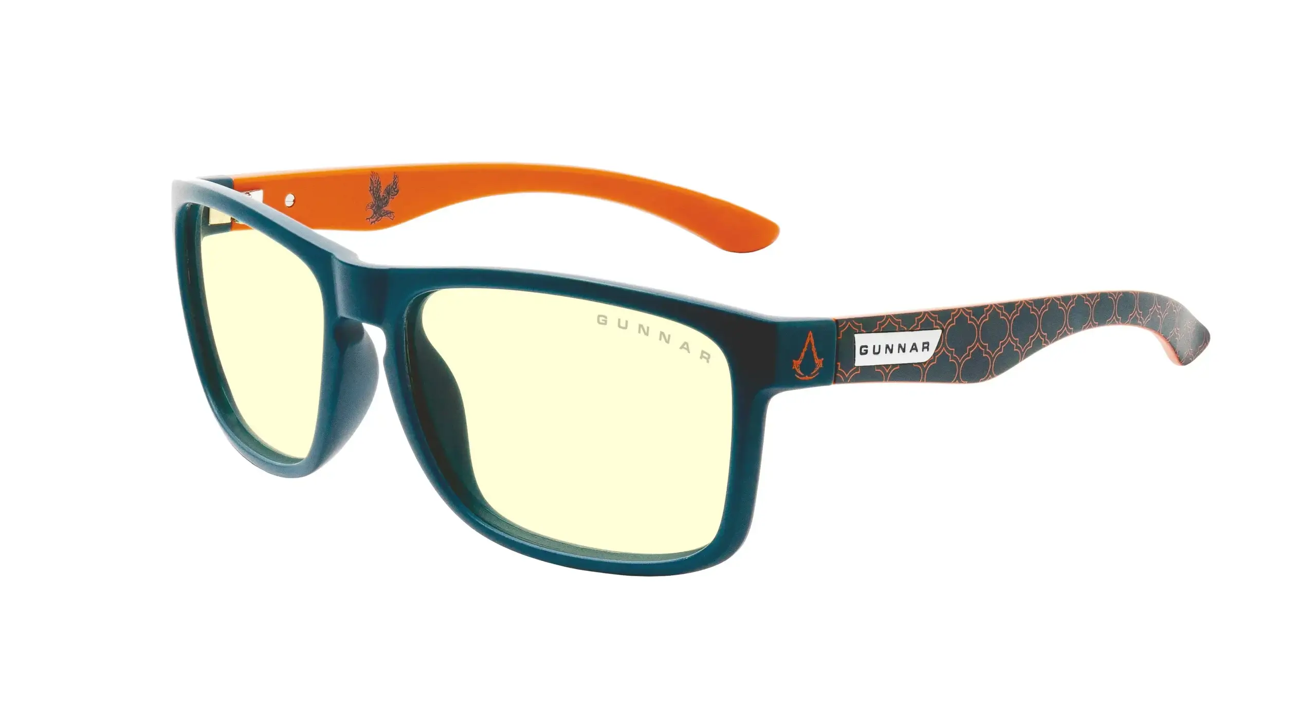 A close up photo showing the Intercept Assassin's Creed Mirage glasses. The semi-rimless amber colored glasses have the Assassin's Creed logo etched on the sides of the frame arms.
