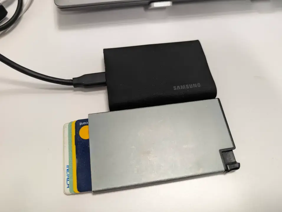 Fast Data Backup On-The-Go: The Samsung Portable SSD T9 Review | Smart Tech, Sharp Takes - CRYOVEX.com The samsung t9 ssd drive size compared to a credit card displaying the slim and compact portable design.