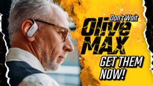 A man wearing olive max wireless earbud hearing aids - sleek white/black earbuds in ears. Earbuds have a wraparound your ear design.