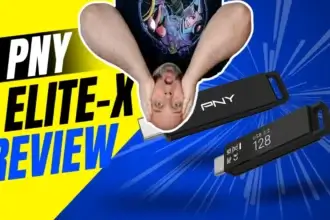 The PNY Elite-X USB 3.2 flash drive in hand with reviewer hanging upside down behind review text