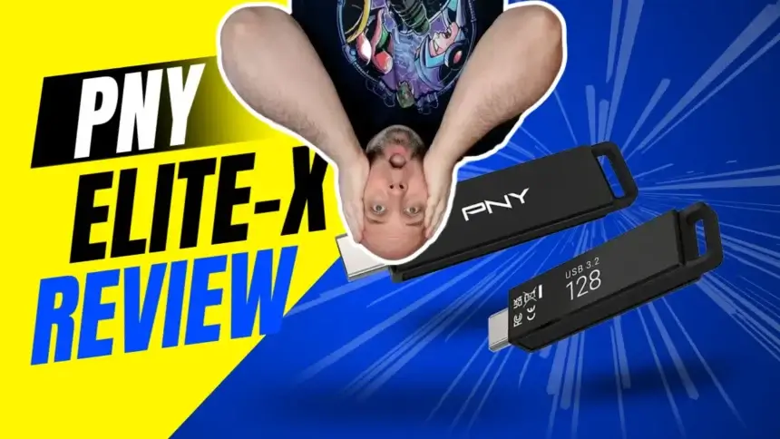 The PNY Elite-X USB 3.2 flash drive in hand with reviewer hanging upside down behind review text