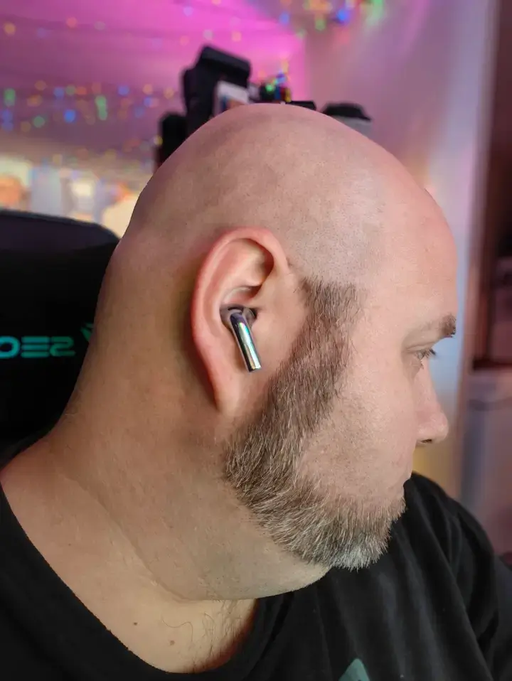 A man wearing oneplus buds 3 with active noise cancellation turned on - review