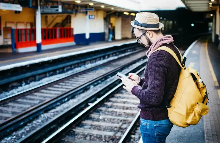 Men using unlocked android smartphone while traveling abroa