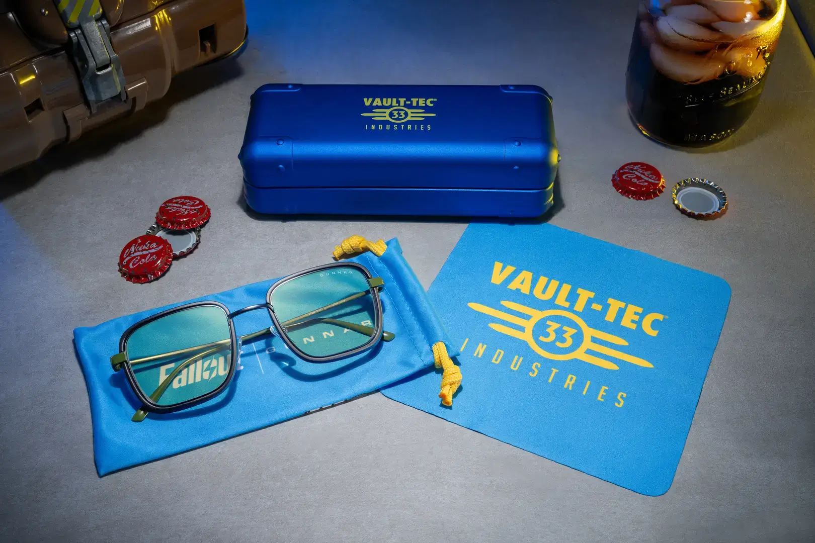 Gunnar optiks fallout vault 33 glasses in gunmetal and olive, featuring a retro-futuristic square frame inspired by the fallout series, with blue light blocking lenses, side shields, and collectible packaging celebrating fallout’s 28th anniversary sale.