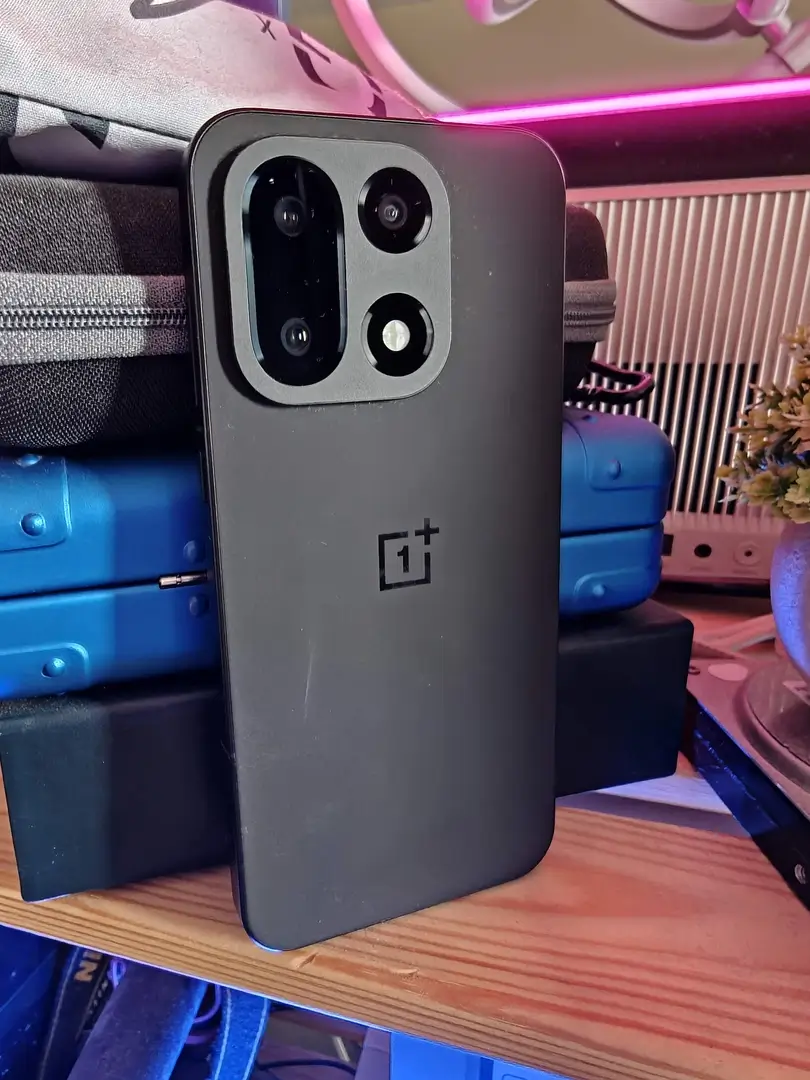 OnePlus 15 Canadian Review: The Powerful Flagship Killer Canadians Can Finally Get Their Hands On | Smart Tech, Sharp Takes - CRYOVEX.com Back of the oneplus 15 showing the square camera module, triple 50mp lenses, and sand storm fibreglass finish