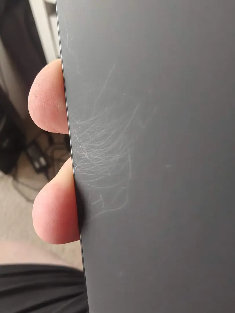 OnePlus 15 Canadian Review: The Powerful Flagship Killer Canadians Can Finally Get Their Hands On | Smart Tech, Sharp Takes - CRYOVEX.com Back of the oneplus 15 showing visible surface scratches on the rear finish everywhere. A case is required.