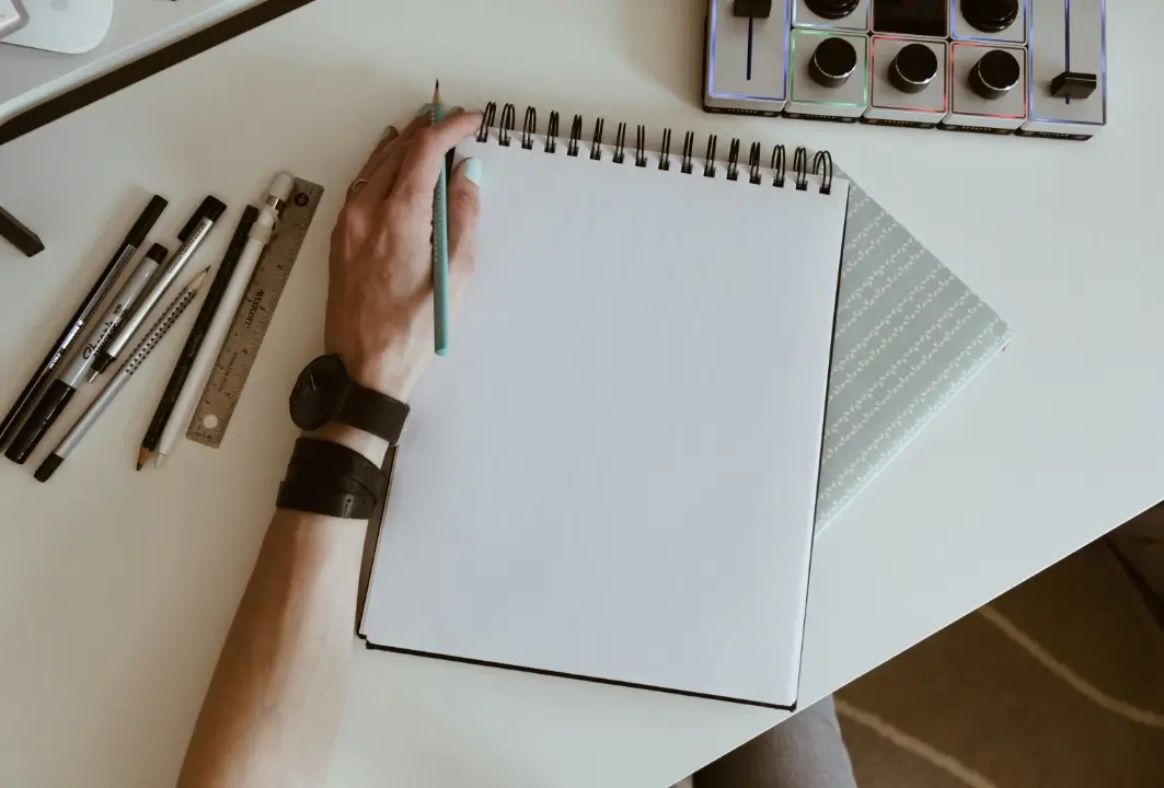 Left-handed person using everyday tools in a right-handed world, highlighting common challenges and practical solutions