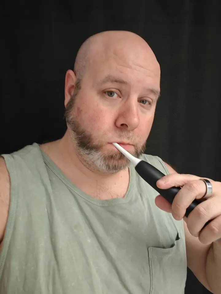 Philips Sonicare Series 6100 Review: A Surprisingly Thoughtful Toothbrush | Smart Tech, Sharp Takes - CRYOVEX.com Martin guay brushing teeth with philips sonicare series 6100 electric toothbrush showing real-world use