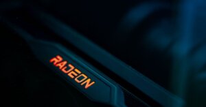 AMD Radeon RX 9050 4 GB Benchmarks Surface | Smart Tech, Sharp Takes - CRYOVEX.com Detailed view of a glowing radeon graphics card highlighting its hardware design.