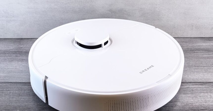 Ecovacs X12S OmniCyclone brings hands-off cleaning to Canada | Smart Tech, Sharp Takes - CRYOVEX.com Sleek white robot vacuum cleaner on a wooden floor, perfect for smart home setups.