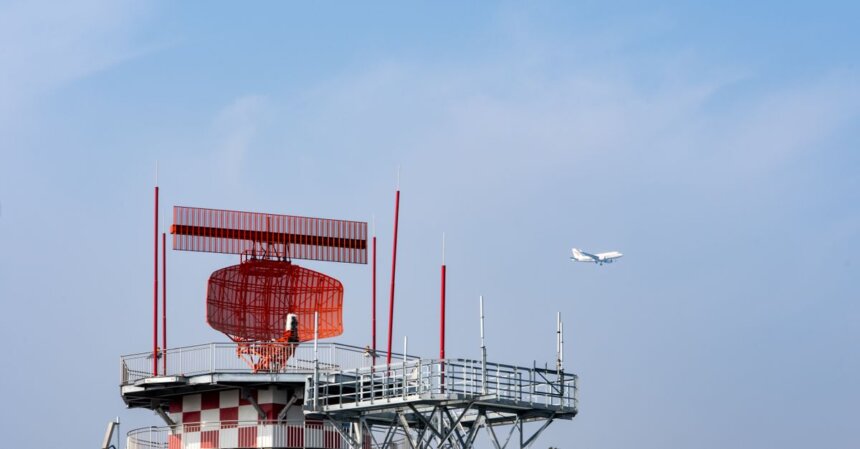 FAA Deploys $875 Million AI Air Traffic Tool in DC Airspace | Smart Tech, Sharp Takes - CRYOVEX.com Radar tower and airplane in a blue sky, showcasing aviation technology