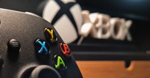 GTA 6 Online multiplayer remains unconfirmed despite industry speculation | Smart Tech, Sharp Takes - CRYOVEX.com Detailed view of xbox gaming controller with vibrant buttons displayed indoors.