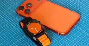Hands-on with iPhone 18 Pro and the latest Apple Watch lineup | Smart Tech, Sharp Takes - CRYOVEX.com A vibrant orange smartphone and smartwatch with matching features on a blue grid background, highlighting modern technology.