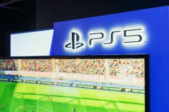 Ps5 gaming station featuring a live soccer match onscreen, showcasing high-quality graphics.