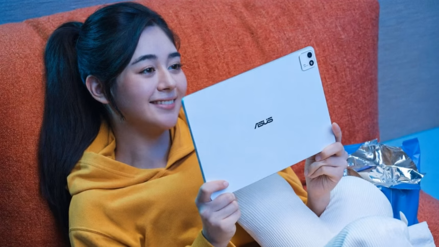 Asus zenbook laptop displayed alongside a tablet device in a retail setting
