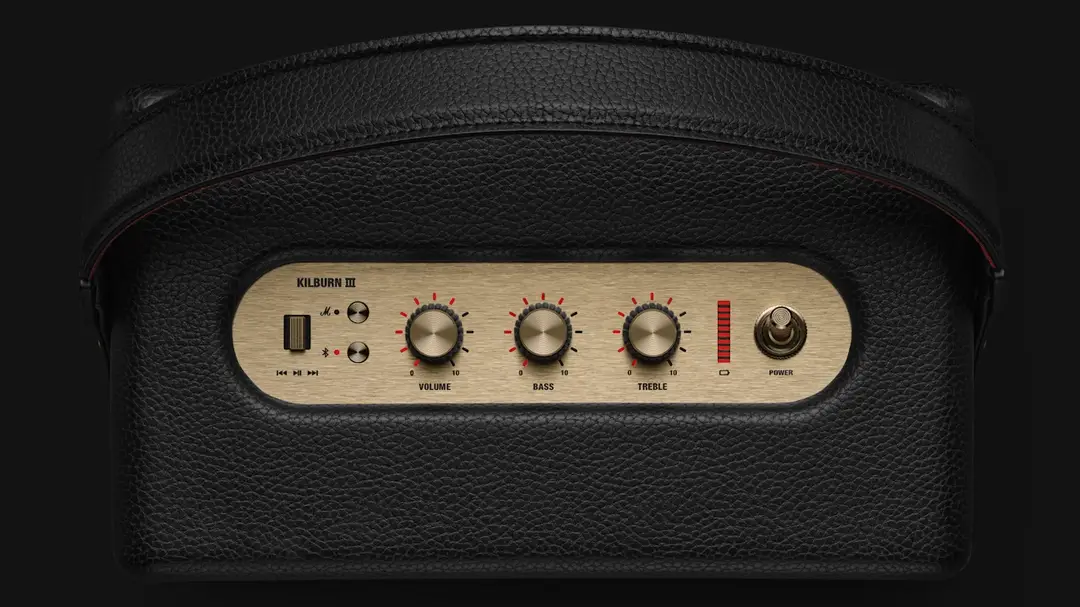 Marshall Kilburn III Review: Incredible Sound, Retro Style | Smart Tech, Sharp Takes - CRYOVEX.com Top view of the marshall kilburn iii bluetooth speaker showing its gold control panel, volume, bass and treble knobs, led battery indicator, power switch and black textured carrying strap.