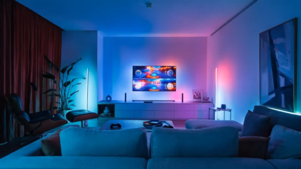 New Home Entertainment Gadgets Aim to Elevate At-Home Cinema Experiences | Smart Tech, Sharp Takes - CRYOVEX.com Collection of home entertainment devices including a projector and snack organizer on a coffee table
