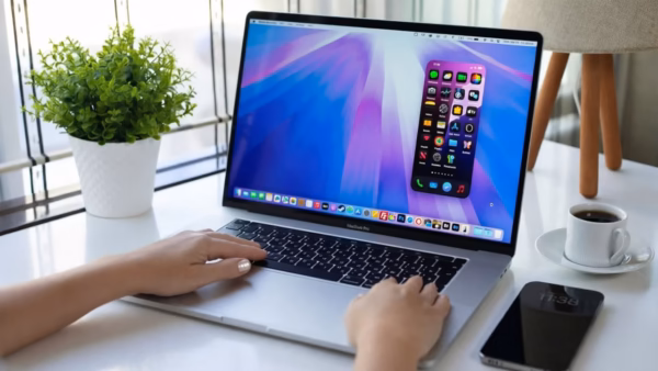 Close-up of a macbook screen displaying security warning icons